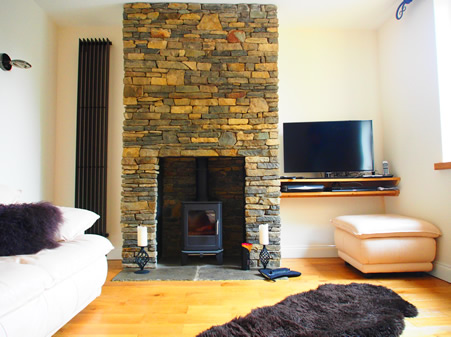 Stonework Fireplace with Free Standing Log Burner